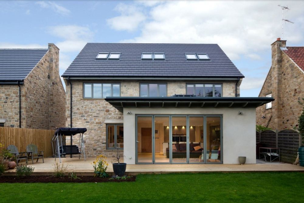 New build extension with stone cladding and bi-fold doors